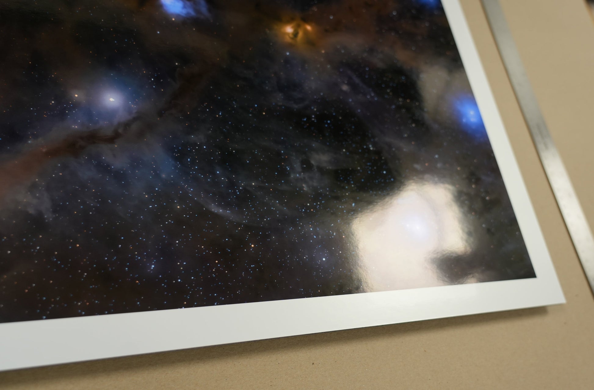 Close-up of a space-themed print with celestial bodies on a plain background
