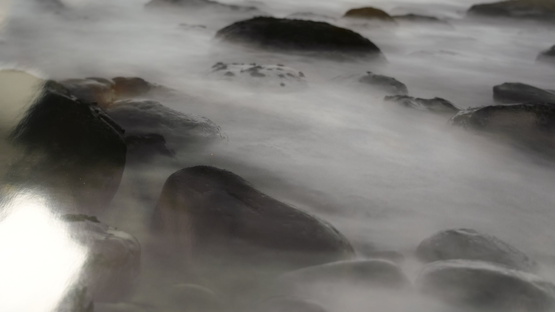 Close-up of flowing water over rocks
