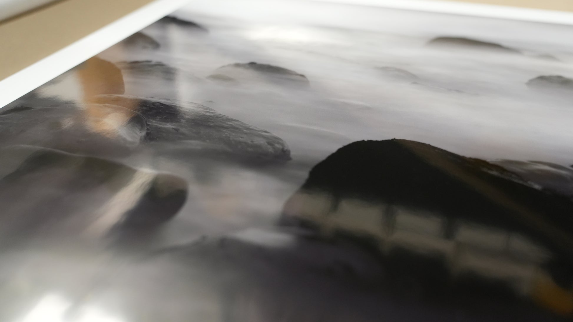 Blurry image of a metallic surface with reflections