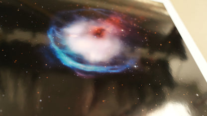 Colorful nebula graphic on a reflective surface