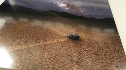 Small black object on a textured brown surface with a blurred background