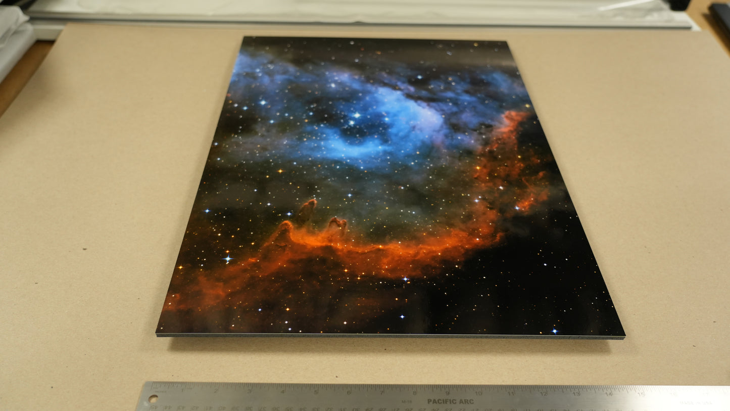 Starry night sky print on a flat surface with a ruler for scale.