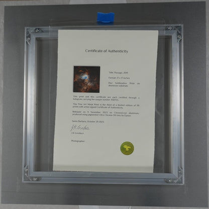 Framed document with a certificate inside, placed on a surface with a ruler for scale.