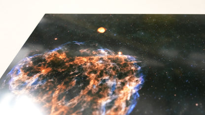 Starburst galaxy with a bright central region and smaller stars in the background