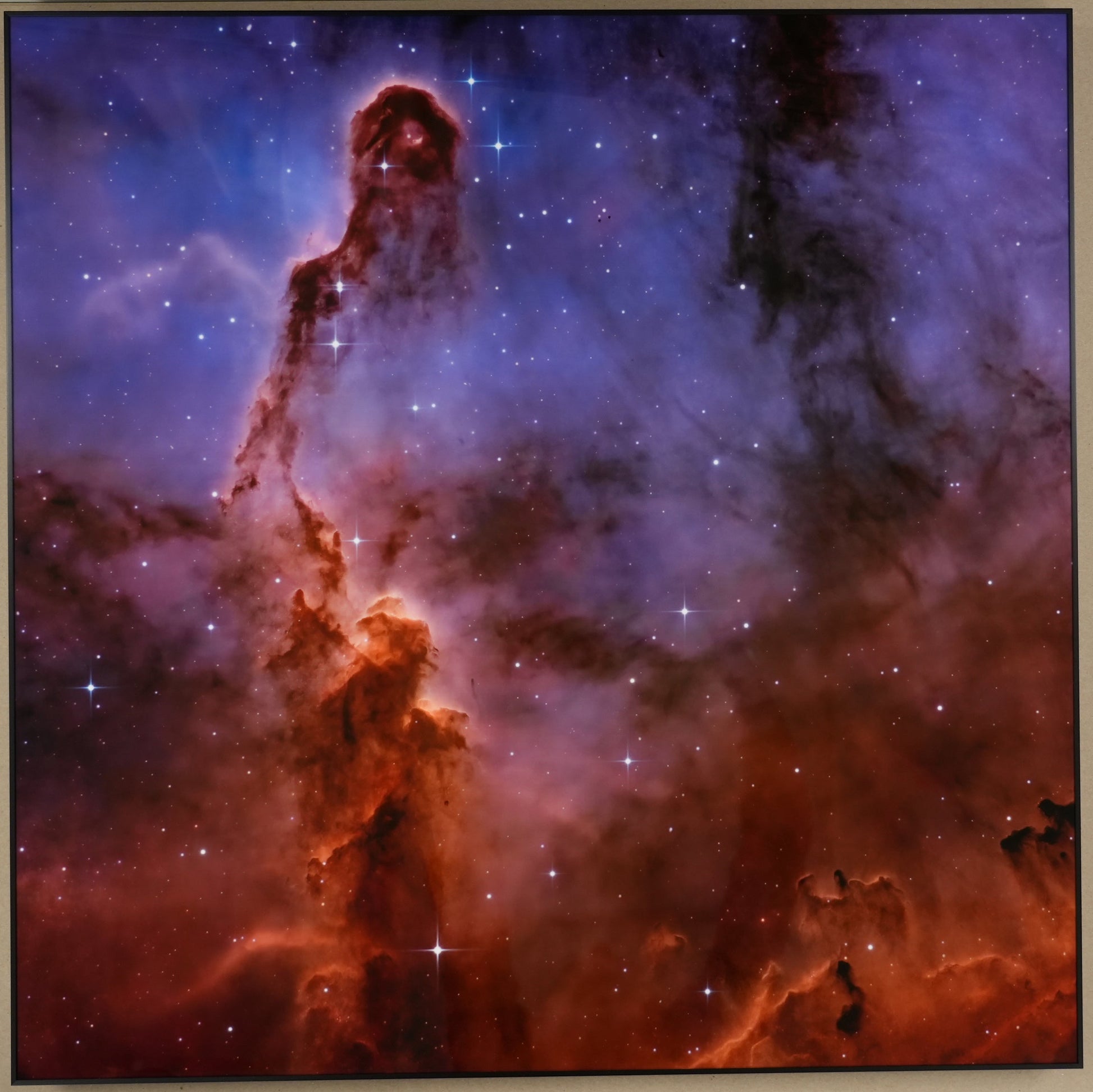 Space nebula image on a cardboard box with tools in the background