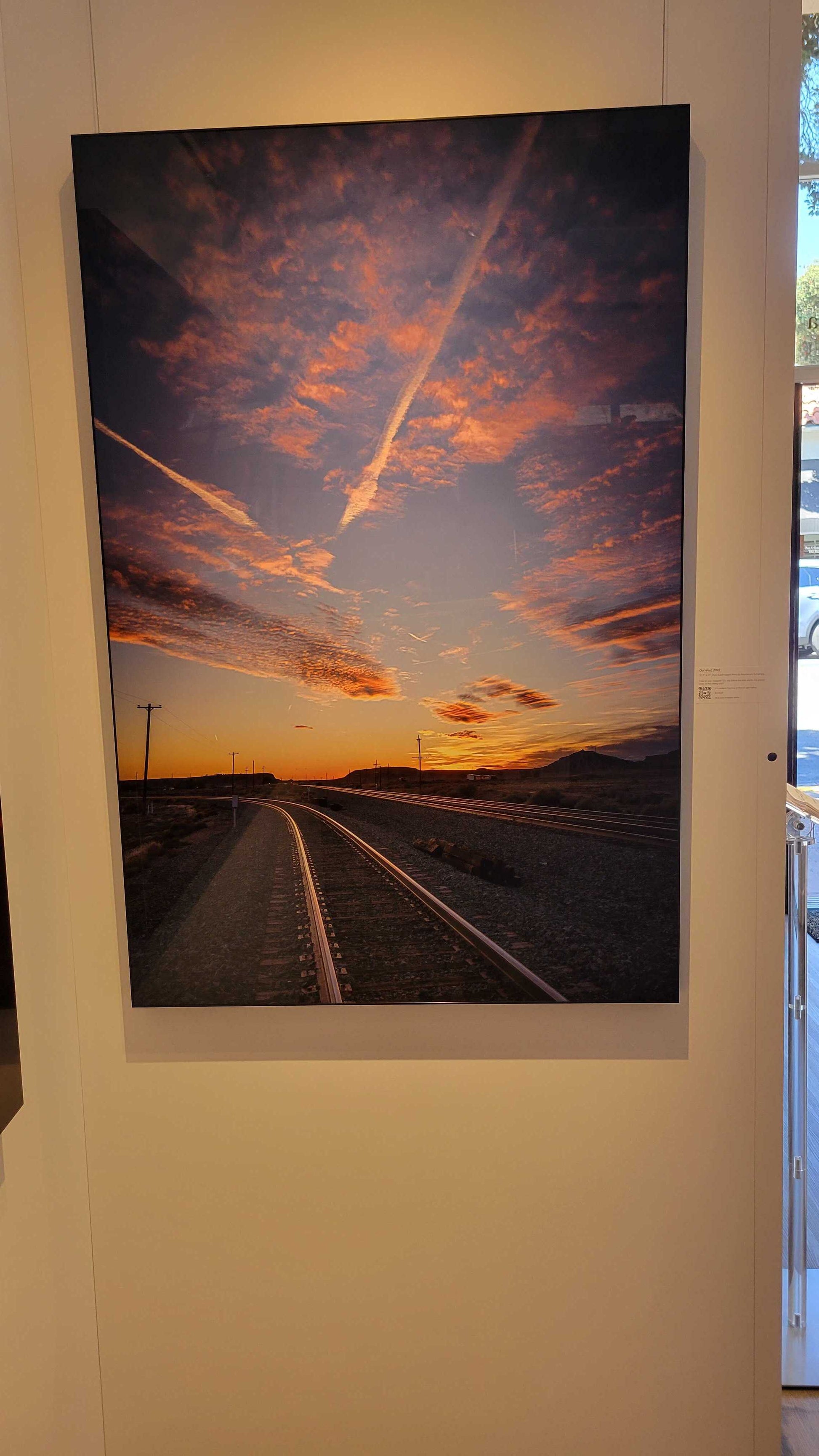 A photograph of the metal print titled, "Go West" shot by landscape photographer J K Lovelace, on display in Slice of Light Gallery