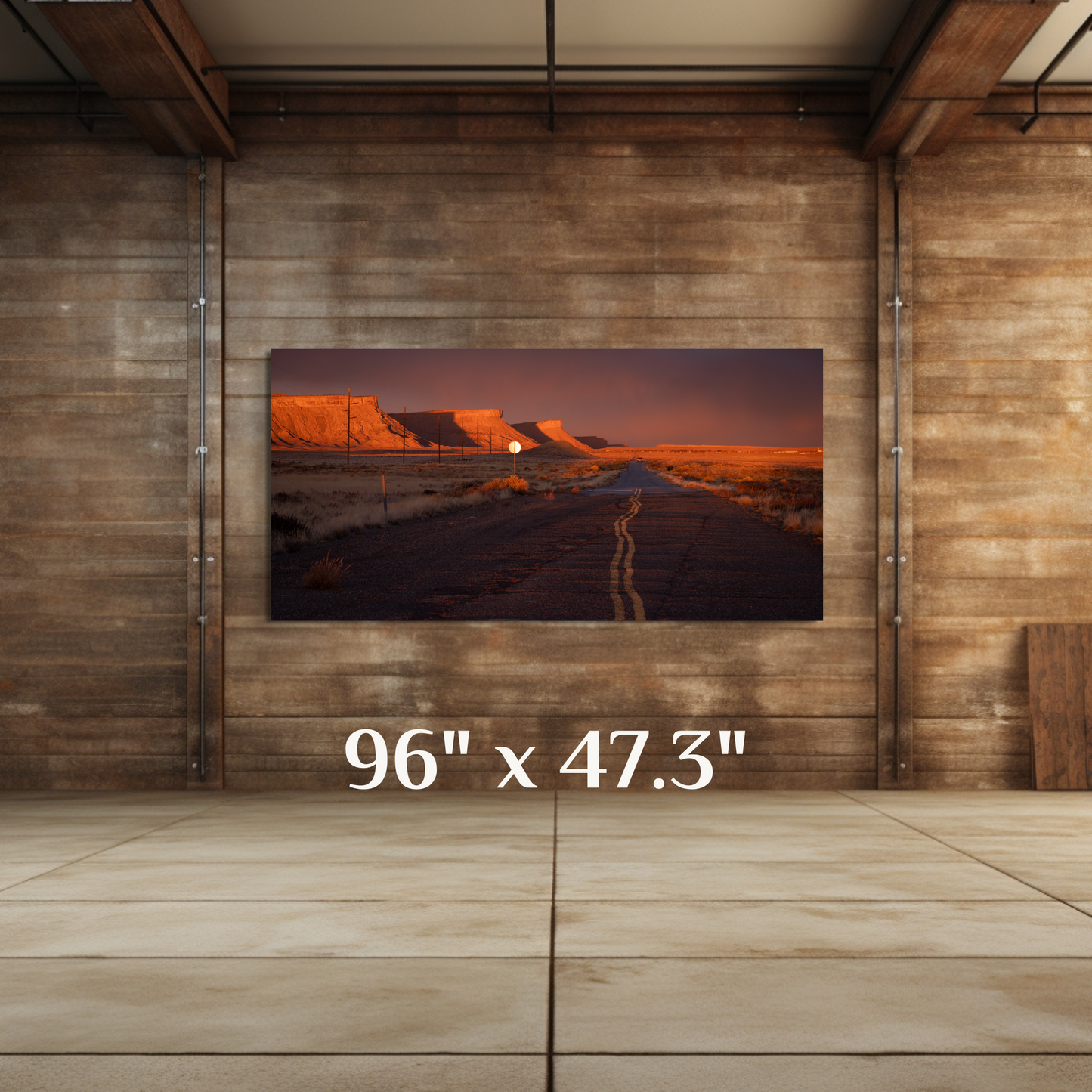 A wall art mockup featuring the photograph titled, "Heading Home" shot by landscape photographer J K Lovelace, as a 96 inch wide metal print with inset frame in a rustic setting.