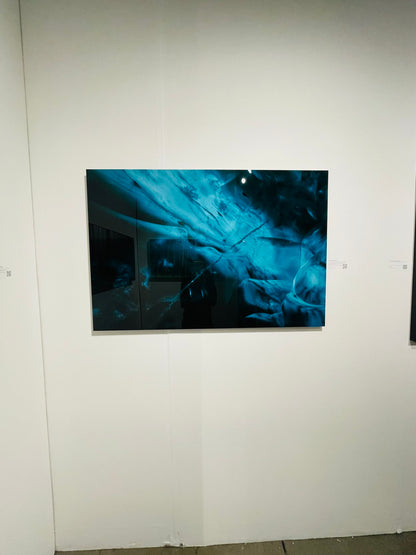 Abstract blue artwork on a white wall