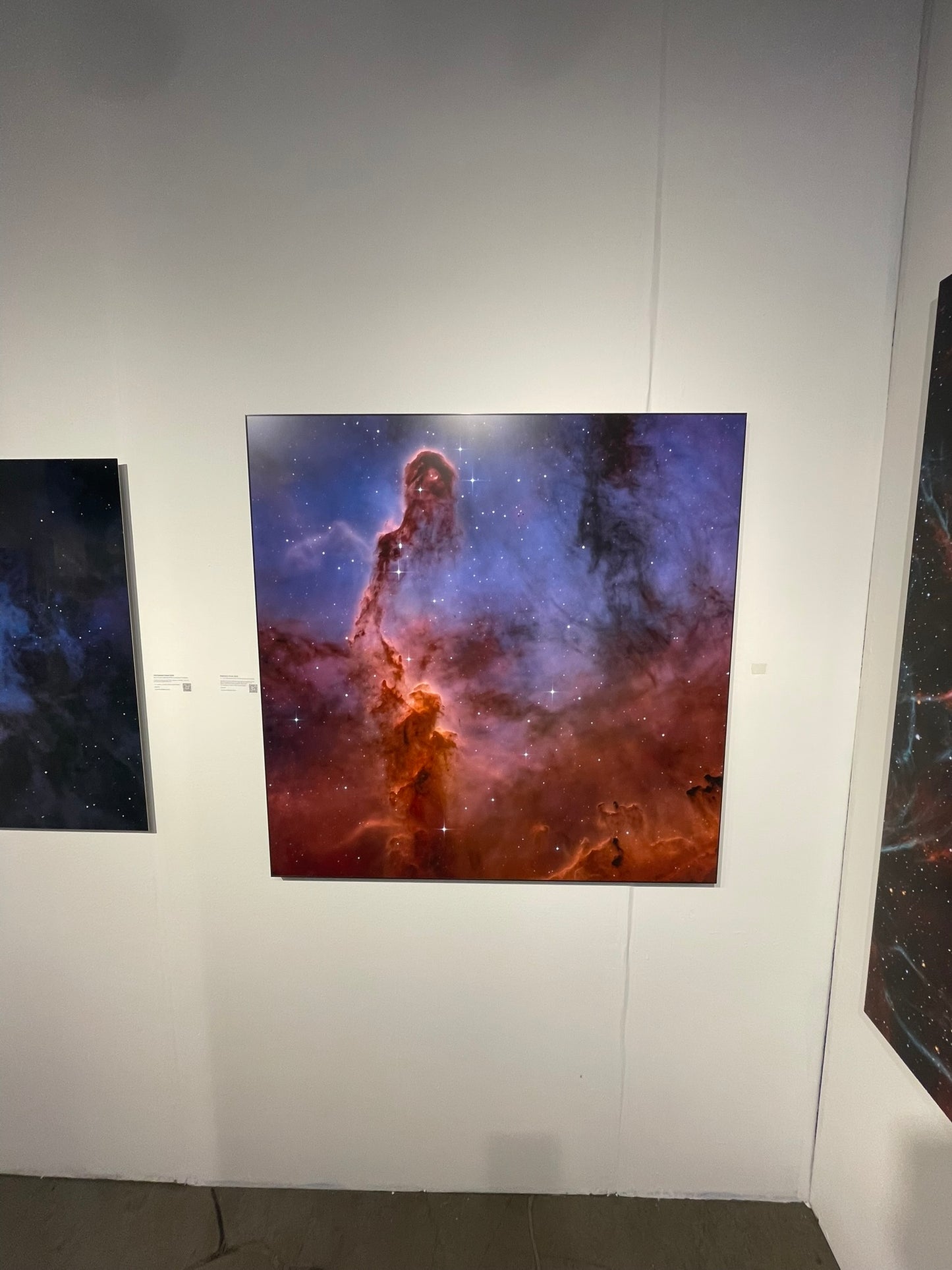 Starry night sky with a nebula on a white wall