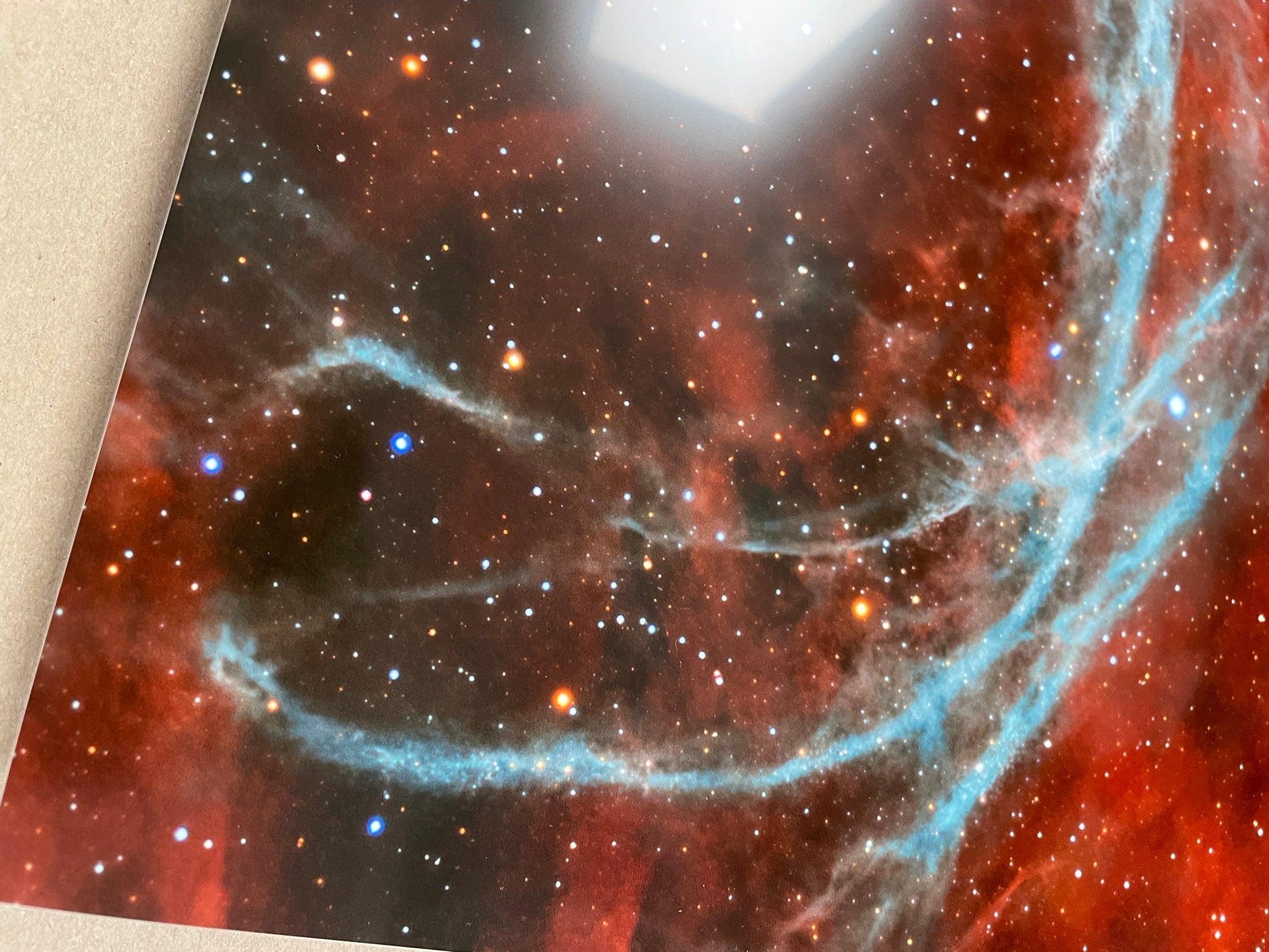 Starry night sky with a nebula and a bright star, possibly a photograph of a space scene.