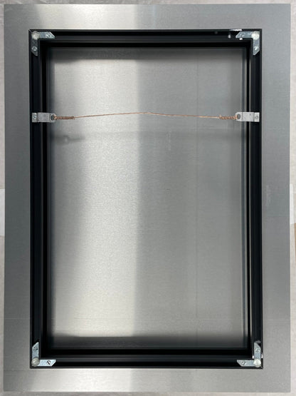 Metallic frame with a central rectangular opening on a white background
