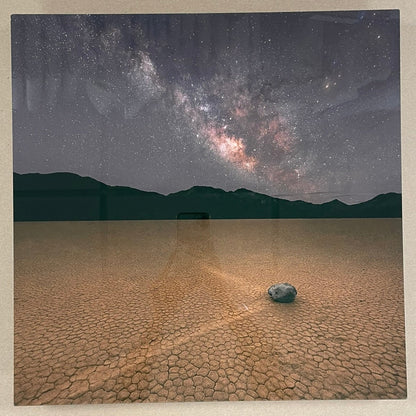 Framed photograph of a desert landscape with a starry night sky.