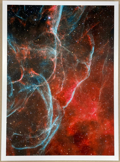 Colorful nebula print on a beige background