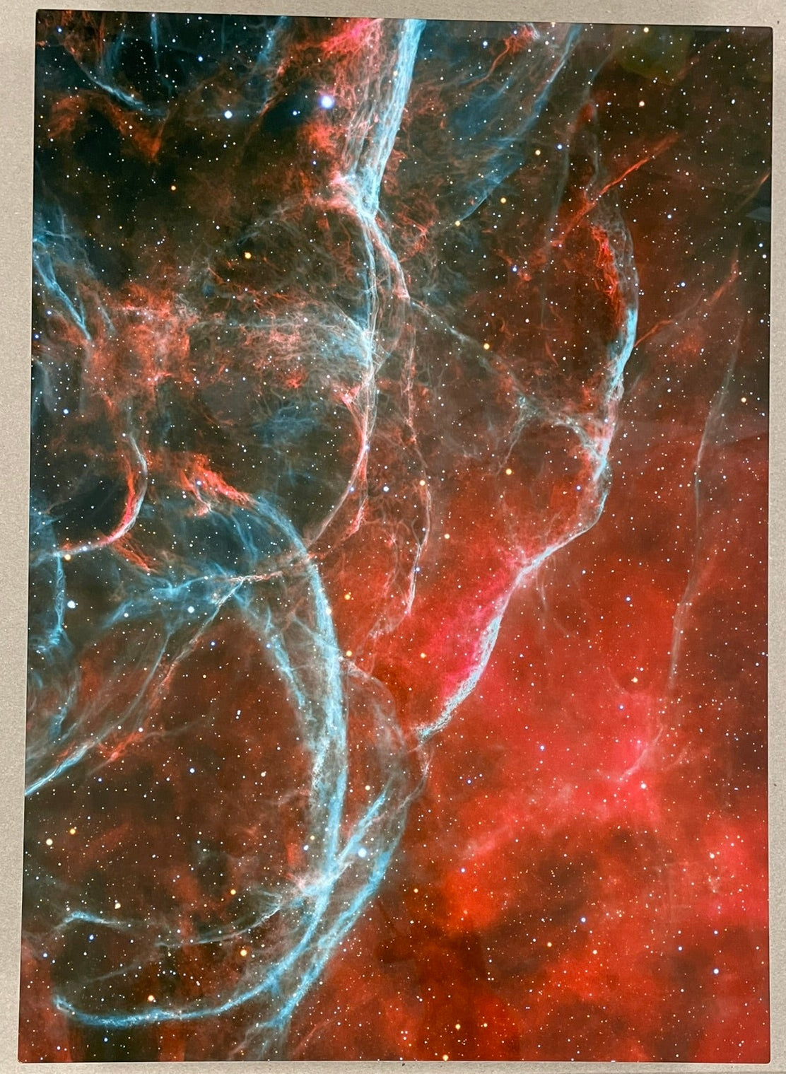 Artistic depiction of a nebula with a ruler for scale on a neutral background