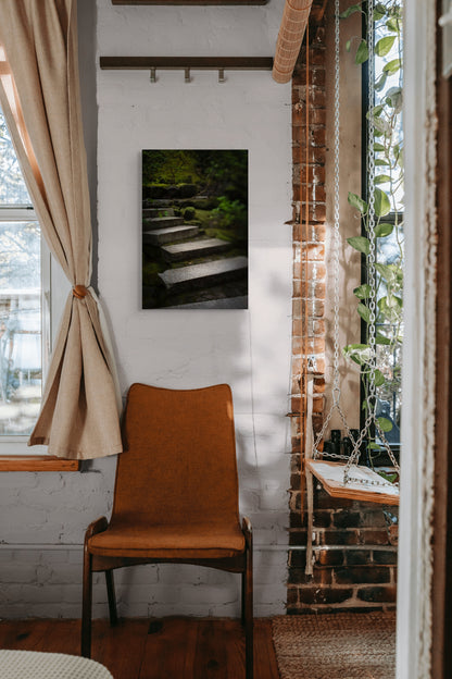 A wall art mockup featuring the photograph titled "Liminal Spaces in the Portland Japanese Garden 10" by landscape photographer Ben Coffman as a 17 inch wide metal print with inset frame on display in a boho chic apartment.