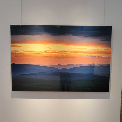 A photograph of the metal print titled "Melting Into Saffron" 60x40 inches n display in Slice of Light Gallery.