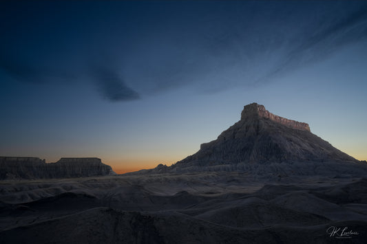 A jpg of the blue hour grand scenic photograph titled "Night Shift" shot by landscape photographer J K Lovelace featuring badlands at dusk