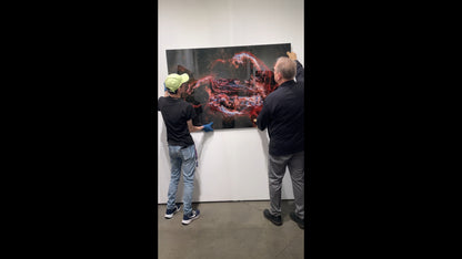 Two people examining a large abstract painting in an art gallery.