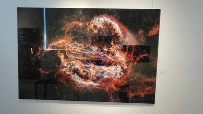 A photograph of the metal print in inset frame and glossy finish titled, "Ouroboros" shot by astrophotographer J K Lovelace, on display in Slice of Light Gallery.