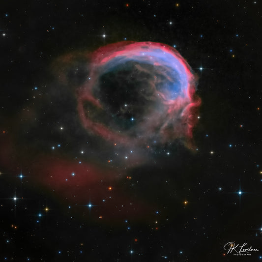 A jpg of the deep sky photograph titled "Profile of an Alien" shot by astrophotographer J K Lovelace featuring the planetary nebula known as the Dolphin Nebula.