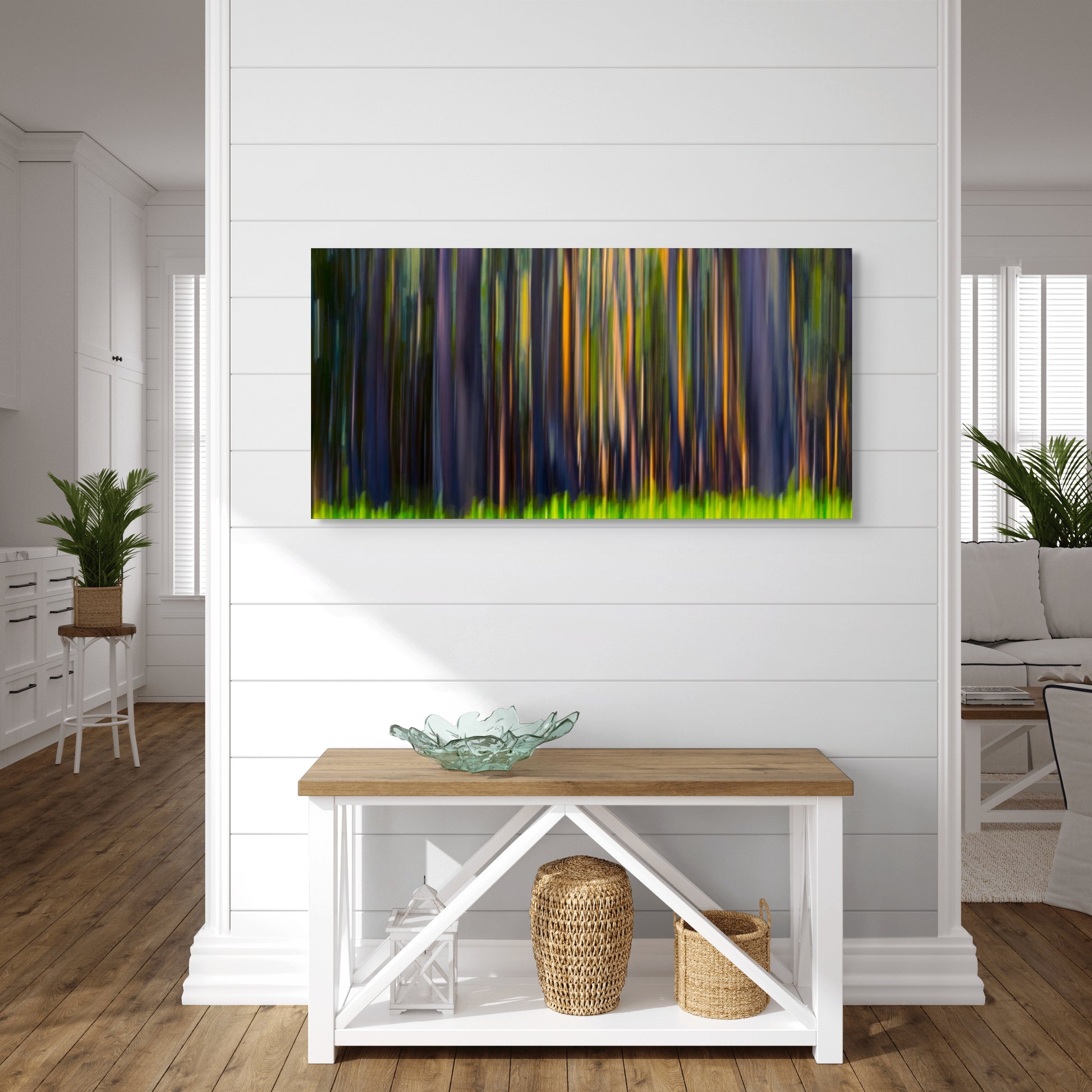 A wall art mockup featuring the photograph titled "Rainbow Eucalyptus, Big Island" by landscape photographer Ben Coffman as a 44 inch wide metal print with inset frame on display in an upscale beach house.
