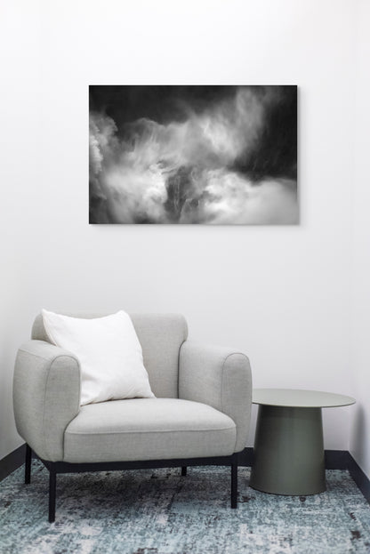 A wall art mockup featuring the photograph titled "Roar Shock I" by landscape photographer Ben Coffman as a 36 inch wide metal print with inset frame on display in a modern waiting room.