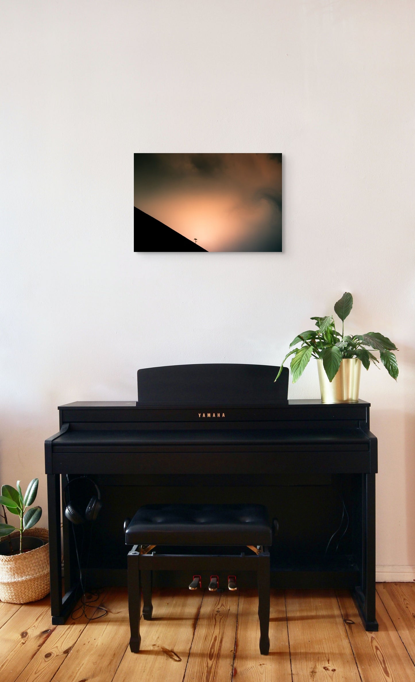 A wall art mockup featuring the photograph titled "Shadow Archetype" by landscape photographer Ben Coffman as a 24 inch wide metal print with inset frame on display in a modern apartment above a piano.