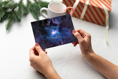 A digital mockup of a greeting card featuring the photograph titled "The Farthest Flower" being held in someone's hands with christmas tree detail out of focus in the background.
