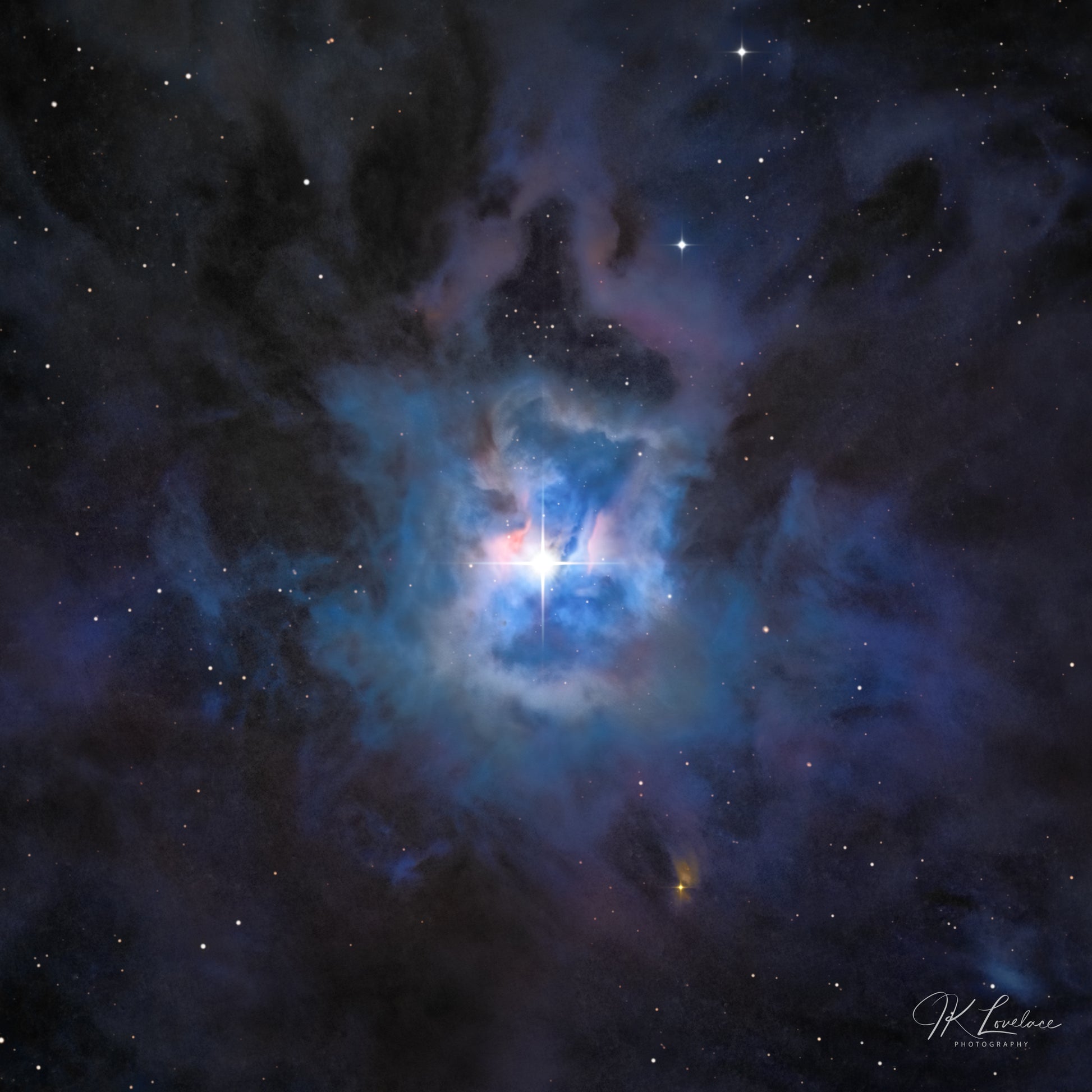 A jpg of the deep sky photograph titled, "The Farthest Flower" shot by astrophotographer J K Lovelace, featuring the deep sky object The Iris Nebula.