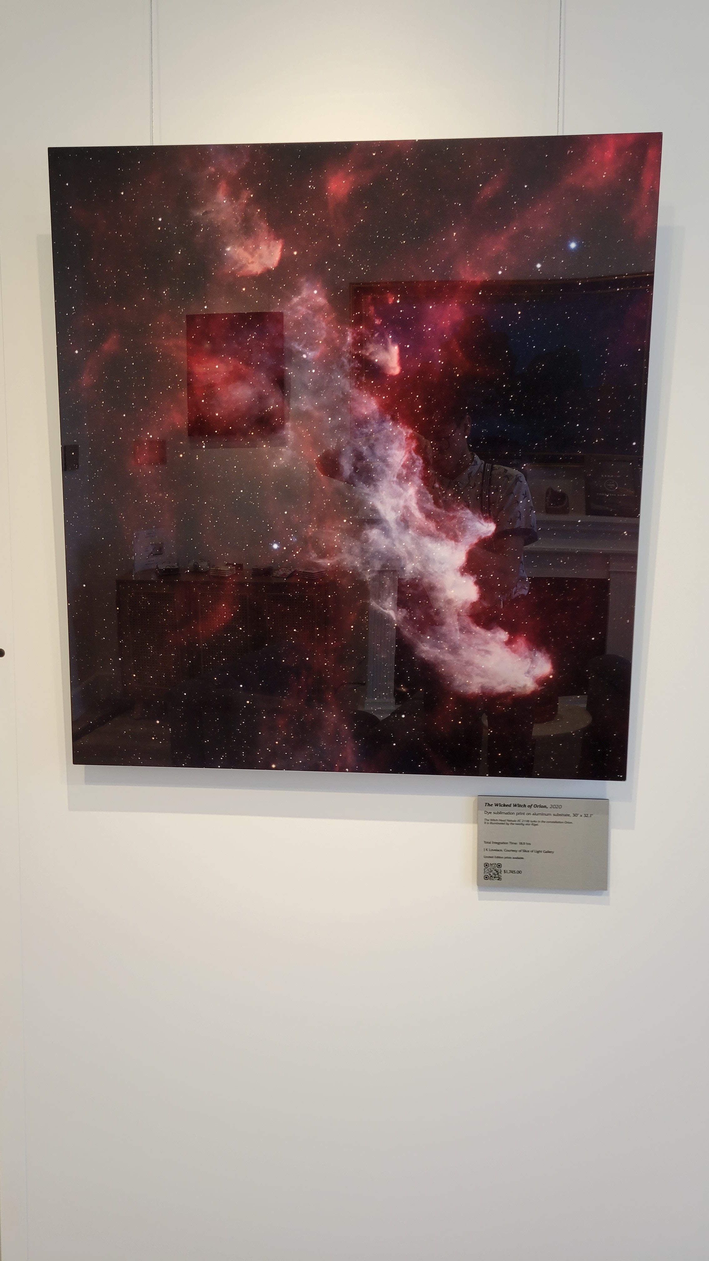 A photograph of the metal print titled "The Wicked Witch of Orion" on display at Slice of Light Gallery.