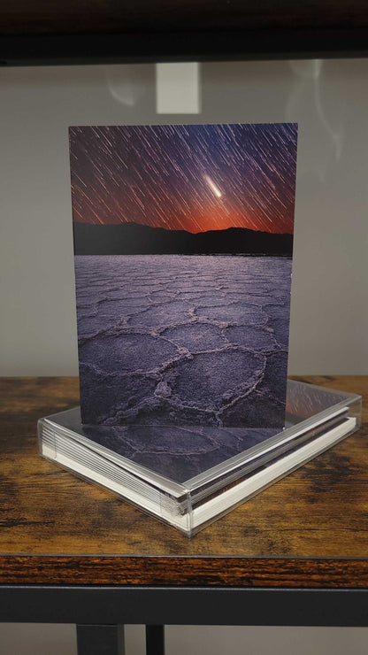 A photograph of the holiday greeting card set featuring the photograph titled "When Beginnings End" on the front cover.