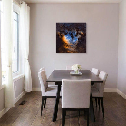 A framed abstract artwork titled 'Blue Heaven' displayed above a dining area, featuring a cloudy blue sky.
