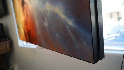 Artistic abstract painting on a wall with a window in the background