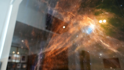 Abstract image of a nebula with vibrant colors on a dark background