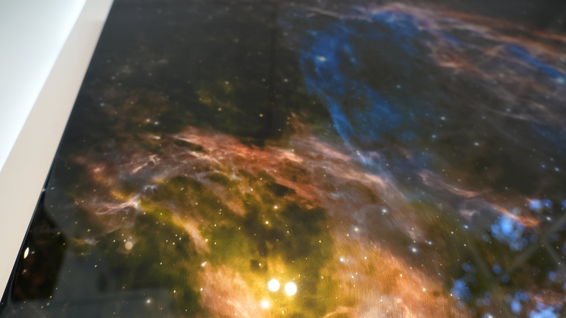 Close-up of a space-themed painting with vibrant colors