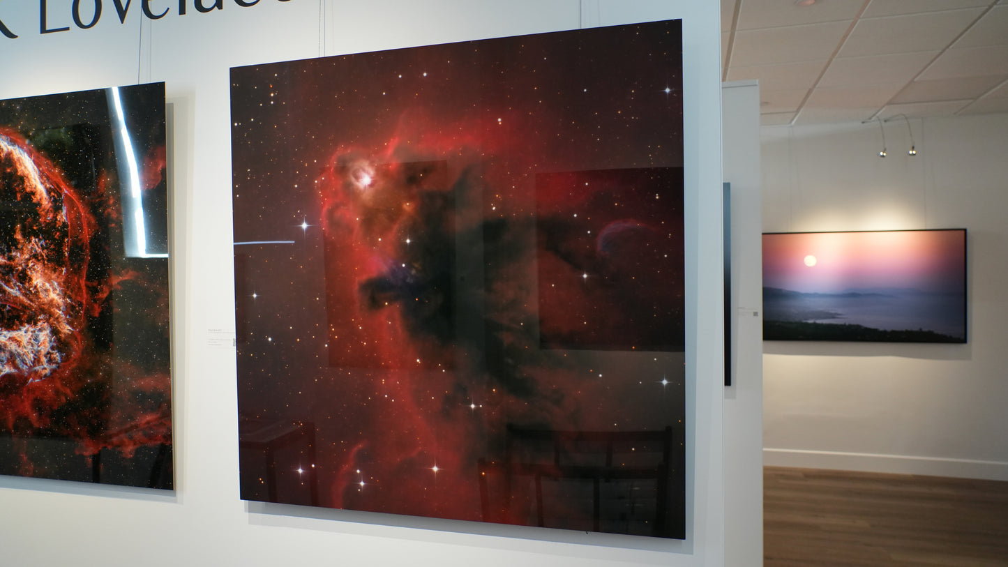 Artistic representations of celestial phenomena on a wall display.