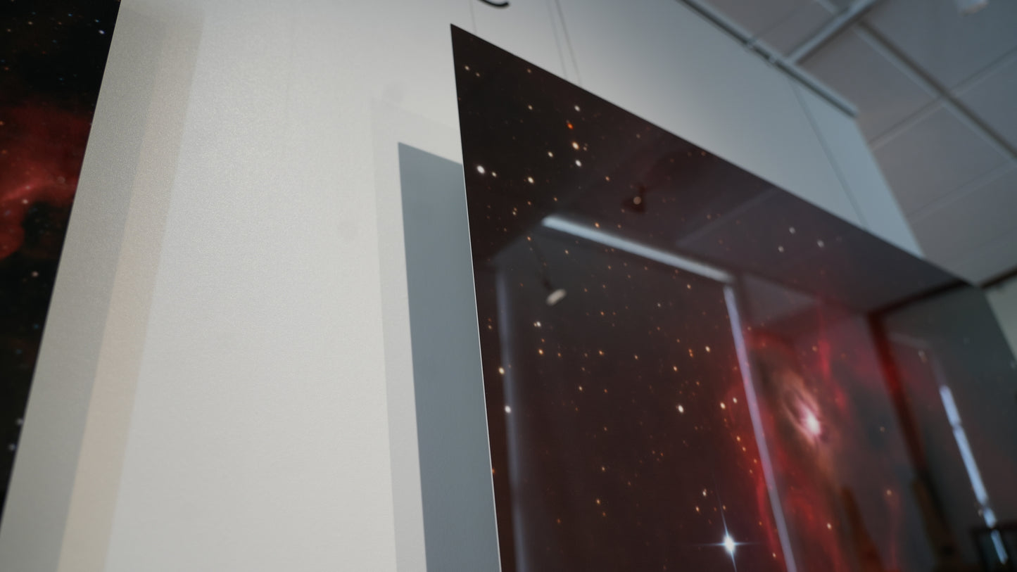 Space-themed wall art on a white wall with a ceiling.