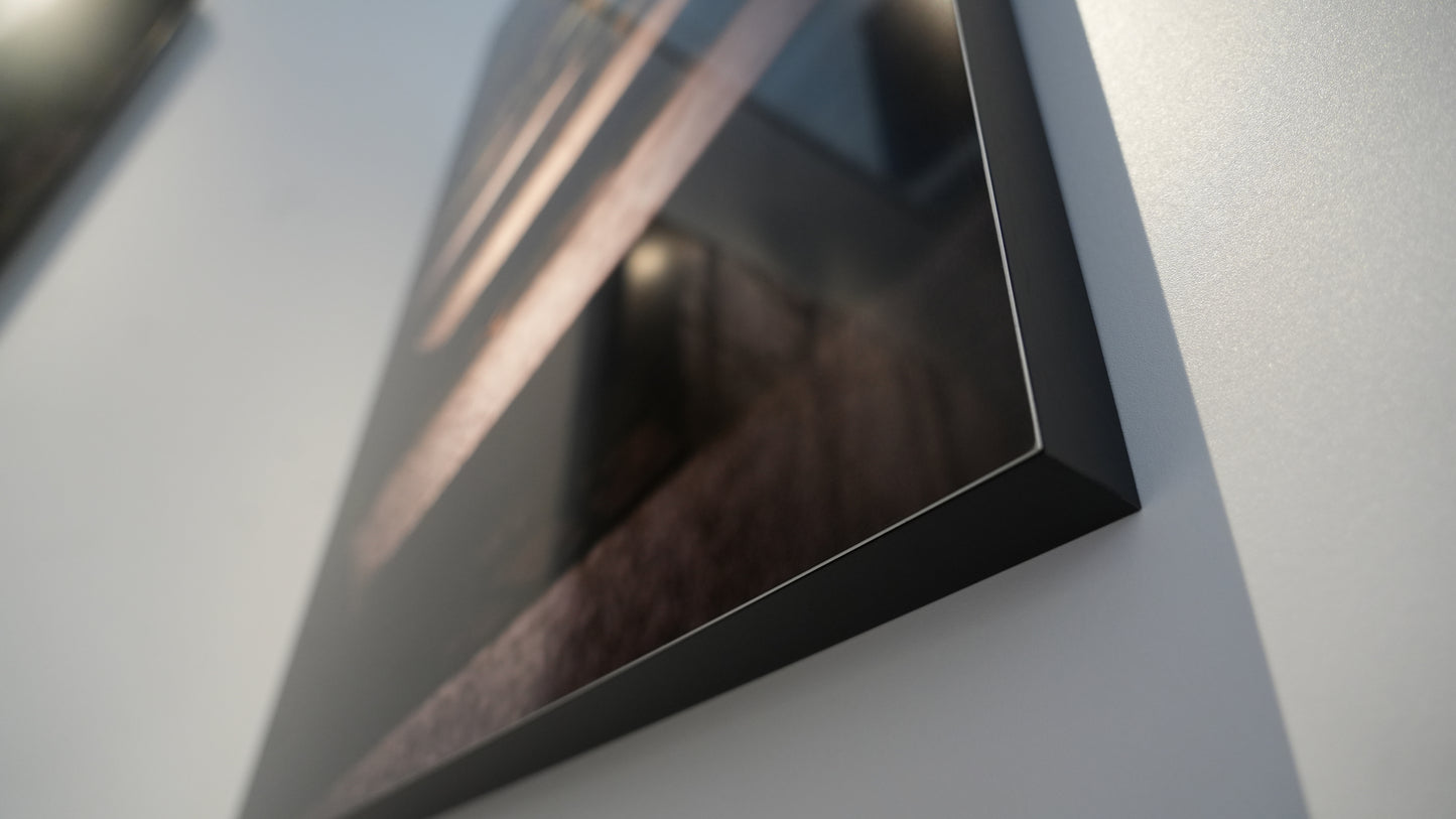 Close-up of a black rectangular object on a light gray background