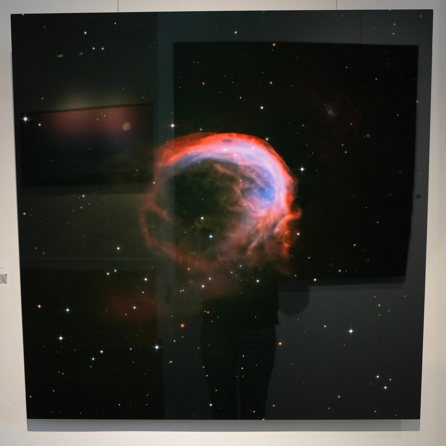 Stellar nebula image on a wall in an exhibition setting