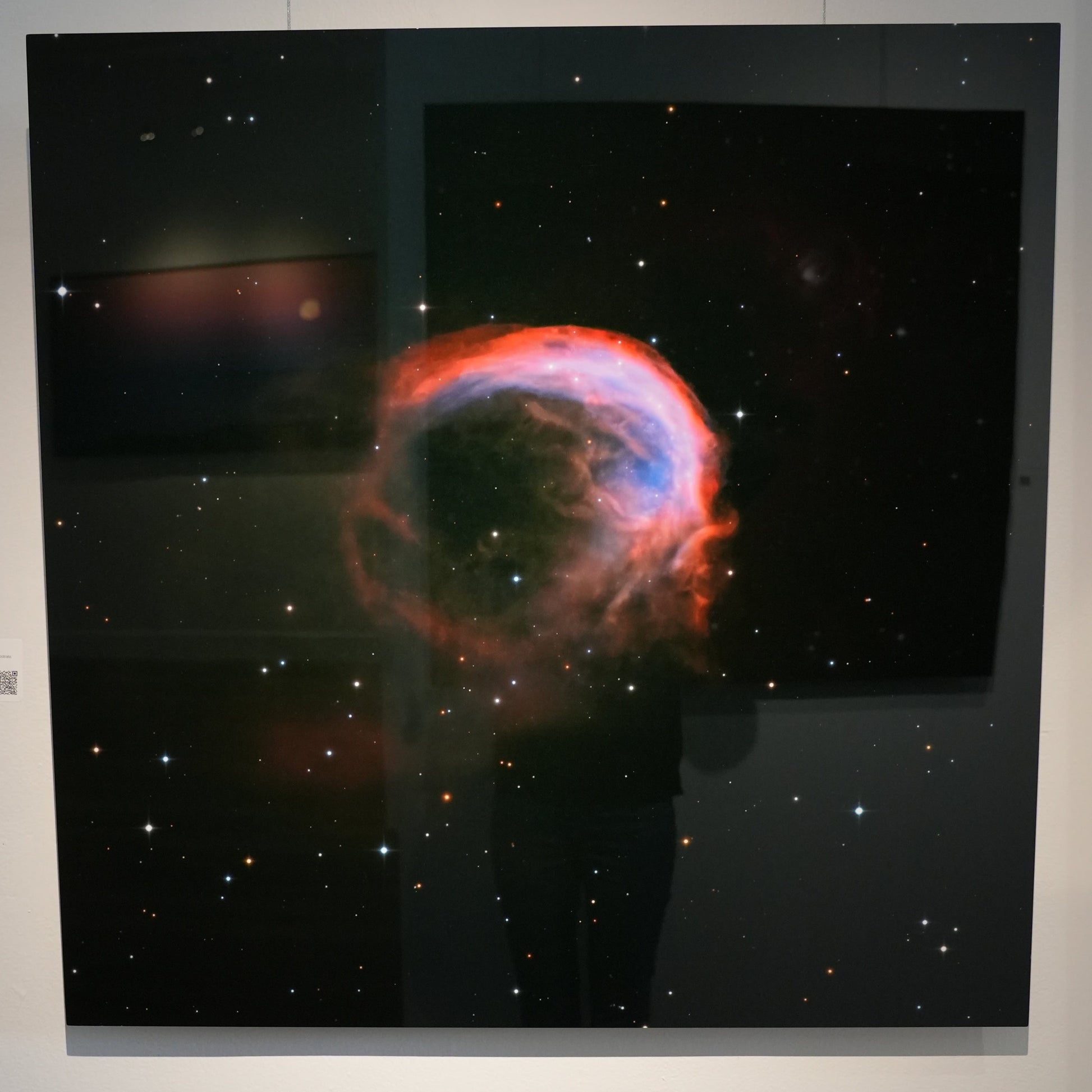 Stellar nebula image on a wall in an exhibition setting