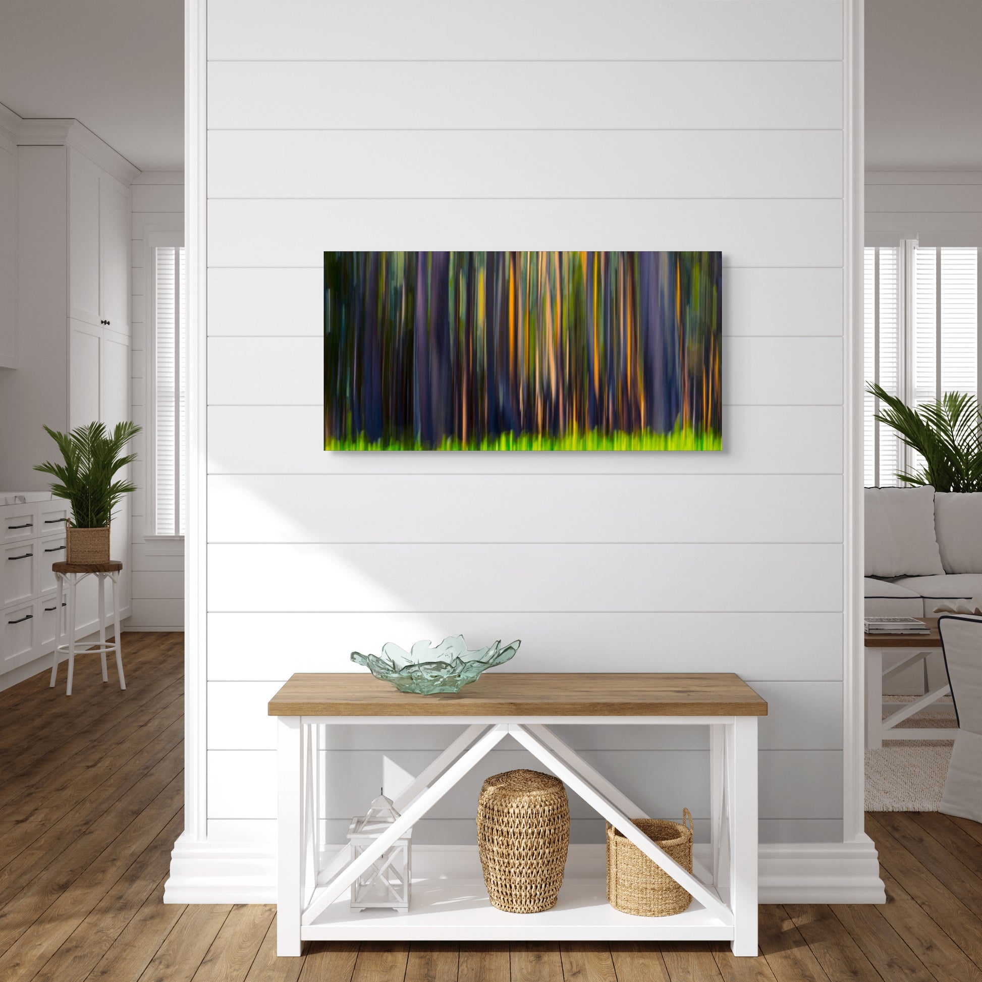 A wall art mockup featuring the photograph titled "Rainbow Eucalyptus" by landscape photographer Ben Coffman as a 36 inch wide metal print with inset frame on display in a modern apartment.