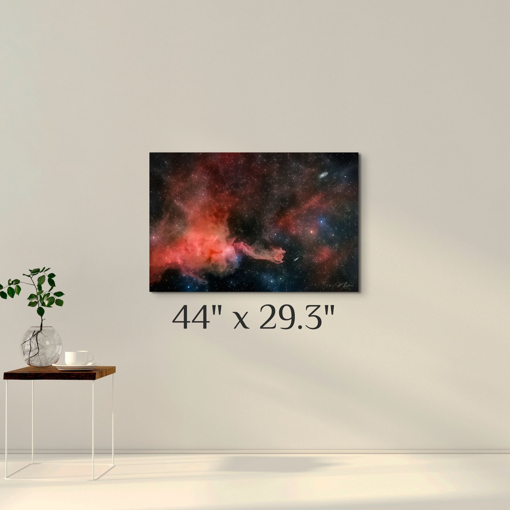 A simple wall art mockup featuring the 44 inch wide metal print titled "Cometary Globule 4 (CG4)" displayed on a wall.