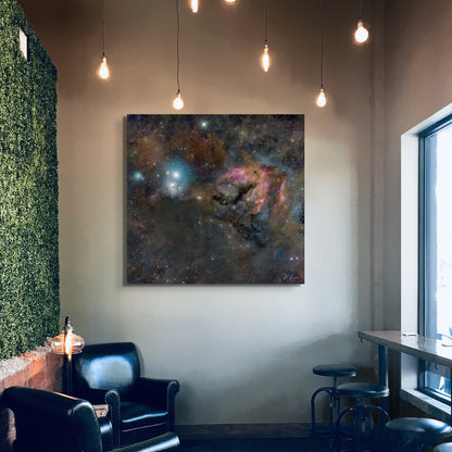 A wall art mockup featuring the metal print titled "The Snail of Perseus" on display in a modern cafe